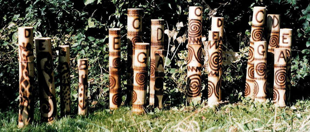 Giant bamboo Stamping Tubes, tuned to pentatonic scales. 